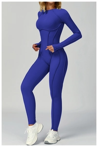 Close-up of royal blue yoga bodysuit featuring decorative piping and elastic slim-fit fabric