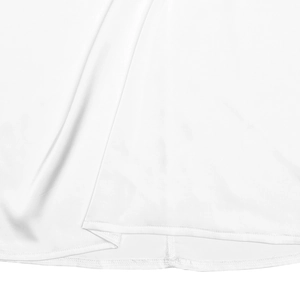 Detailed macro view of the white dress hem showing smooth silk texture and fine stitching