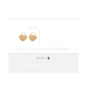 Detailed view of hollow heart earrings with grid texture and gold-plated copper finish