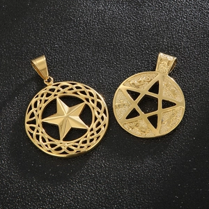 Macro shot of 18K gold plated stainless steel star pendants with Celtic knot and rune details