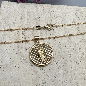 Golden Virgin Guadalupe medallion necklace with shimmering white cubic zirconia stones