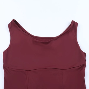 Detail of burgundy sleeveless vest showing reinforced stitching and premium elastic fabric