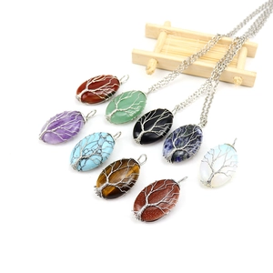 Handmade tree of life natural crystal pendants with intricate silver wire wrapping