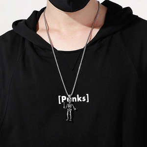 Vintage steel pendant featuring two hugging skeletons with swords on a male model