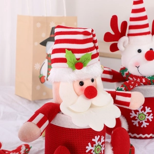 Christmas gift baskets featuring Santa and Reindeer plush designs for holiday candy storage