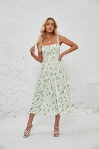 Detail of green floral midi dress featuring front tie design and delicate summer print