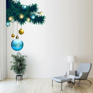 Christmas wall decal featuring pine branches with festive ornaments and lights in a living room