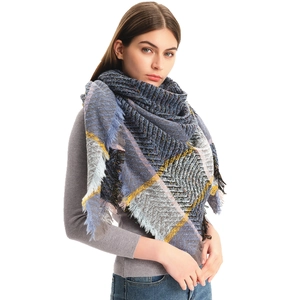 Thick winter plaid scarf for women with blue and yellow check patterns and fringed edges