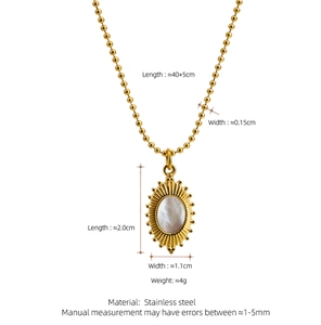 Detail view of gold oval shell pendant necklace with product dimensions and chain length