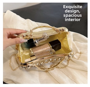 Detailed interior of the gold glitter party clutch showing ample storage for cosmetics