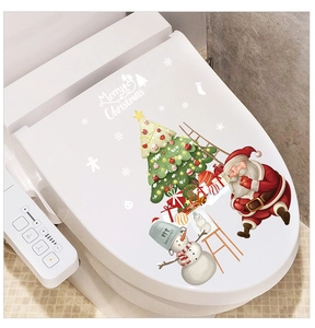 Detailed view of festive Santa Claus and Snowman decals applied on a white toilet lid