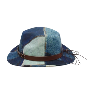 Detail of vintage patchwork denim fedora with brown leather band and metallic studs