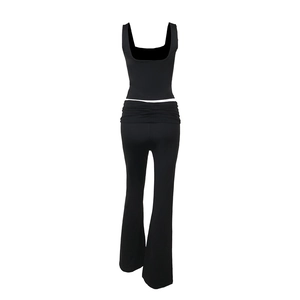 Detail of black two-piece casual set featuring square neck tank top and high waist flared pants