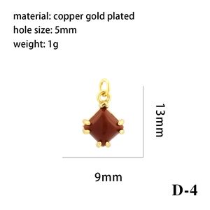 Detailed view of 18K gold plated copper rhombus pendant with red stone inlay and dimensions