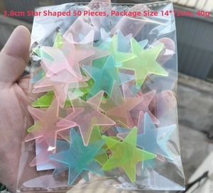 Pack of 50 colorful 3.8cm glow stars in plastic packaging for wall decoration
