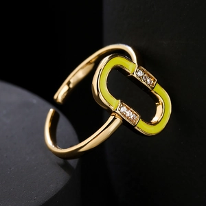 18K gold plated copper ring with yellow enamel and zircon accents on black background