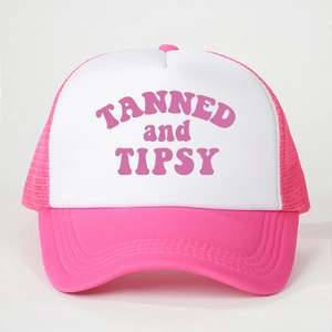 Pink and white mesh trucker hat featuring TANNED and TIPSY slogan for outdoor sun protection