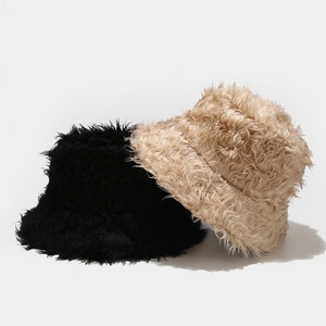 Plush faux fur bucket hats for winter in black and beige with soft fluffy texture