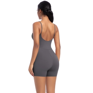 Detail of deep grey backless yoga bodysuit featuring thin straps and bodycon fit
