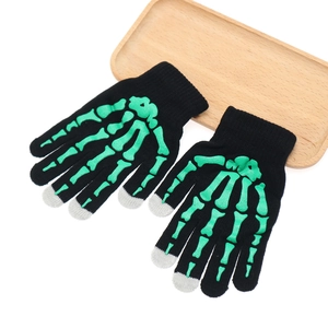 Knitted touch screen gloves with green skeleton bone pattern on black fabric