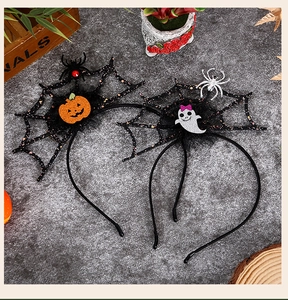 Detail of Halloween headbands with glitter mesh spider webs, pumpkin and ghost icons