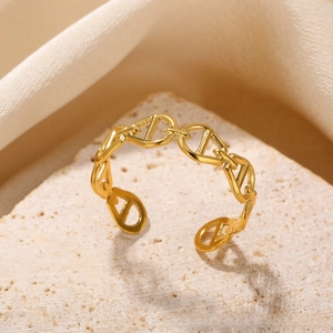 Detailed view of adjustable golden sun moon star ring with chain link hollow design
