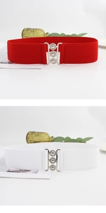 Detail of red and white wide elastic waist belts with silver interlocking metal buckles