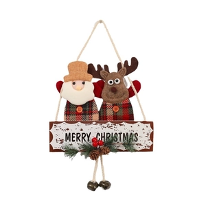 Hanging Christmas decoration with Santa and reindeer on wooden Merry Christmas sign