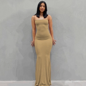Detail shot of the khaki maxi dress featuring thin straps and slim fit silhouette