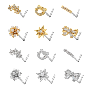 Detailed collection of gold and silver L-shaped nose studs with zirconia and bows