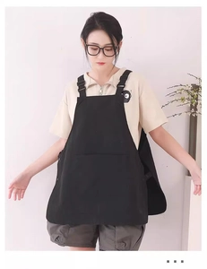 Front view of a black water-resistant Japanese style work apron with minimalist neck strap