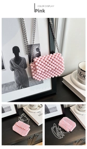 Detail of pink beaded mini crossbody bag with silver metal chain strap and woven texture