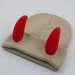 Detail of beige ribbed knit beanie with red devil horns and folded cuff design