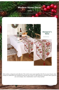 Detail view of festive table runner with reindeer print and red velvet tassel trim