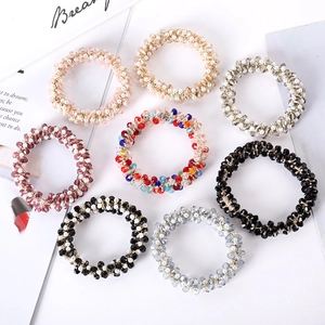 Set of 8 elegant pearl and crystal bead elastic hair ties in assorted fashion colors