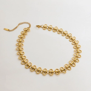 Detailed view of golden titanium steel clover necklace with adjustable lobster clasp