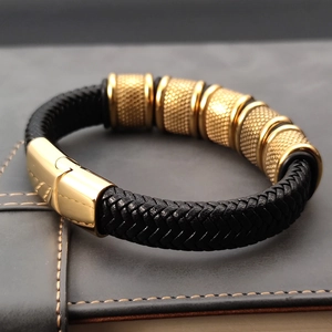 Men's multi-layer woven black leather bracelet with textured golden metal rings