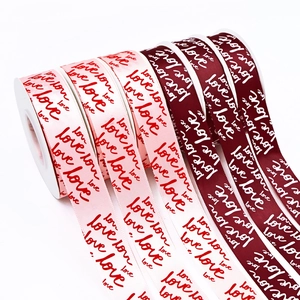 Pink and burgundy love printed satin ribbons in rolls for gift and flower wrapping