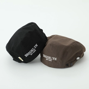 Detail of vintage kids flat caps with BROOKLYN embroidery and adjustable metal buckles