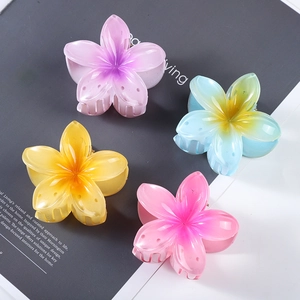 Set of four 7cm gradient plumeria hair claws in pink, blue, orange, and purple resin