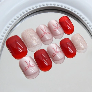 Red bowknot cat-eye press-on nails with fine glitter and jelly red finish, 24pcs set