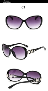 Detail of elegant black oversized sunglasses with silver buckle and purple gradient lenses