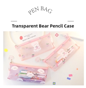 Macro detail of transparent pencil case with heart zippers and cute pink cartoon patterns