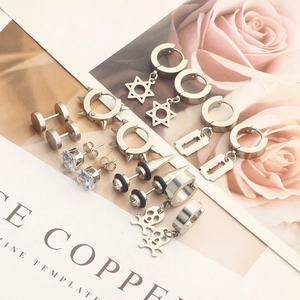 Set of silver stainless steel stud earrings with star, rivet and skull pendants