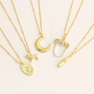 Vintage gold-plated necklaces with moon, dog, and bottle zircon pendants on a bead chain