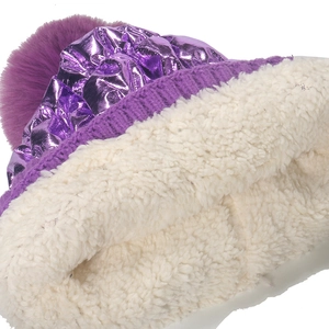 Winter knit hat in purple metallic fabric with soft fleece lining and fluffy pompom
