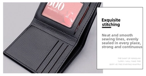 Detail showing the fine stitching and interior card slots of the black leather bifold wallet