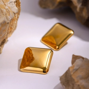 Polished 18k gold stainless steel square earrings displayed on natural stone