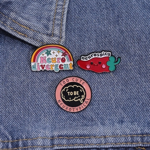 Rainbow neurodivergent and neurospicy enamel pins set on blue denim background