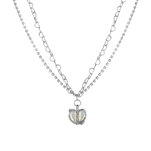 Detail of layered necklace featuring heart-shaped opal pendant and rhinestone pavé chain